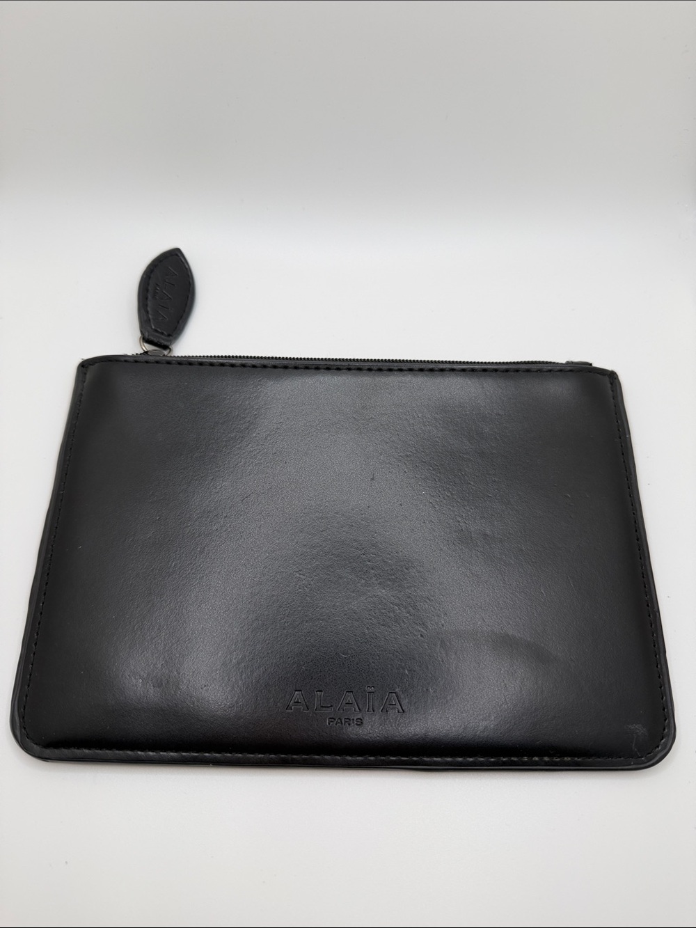Alaia black smooth calf zipper clutch
